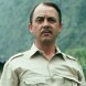 D�c�s de John Hillerman, Higgins dans Magnum
